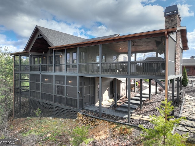 rear view of house with a sunroom