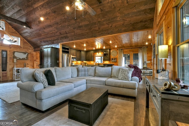 living room featuring ceiling fan, wood walls, hardwood / wood-style floors, lofted ceiling, and wood ceiling