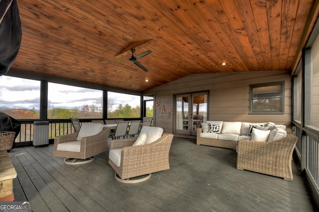 sunroom with french doors, vaulted ceiling, ceiling fan, and wooden ceiling