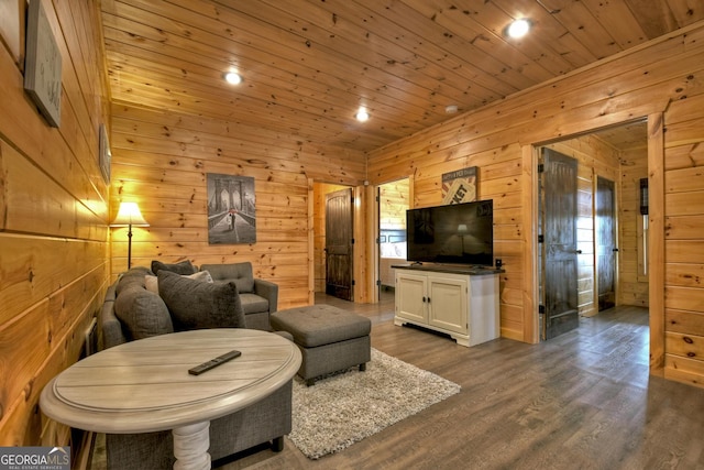 living room with hardwood / wood-style flooring, wooden ceiling, and wooden walls