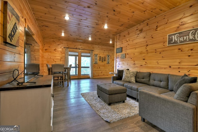 living room with dark hardwood / wood-style floors, wood walls, wood ceiling, and french doors