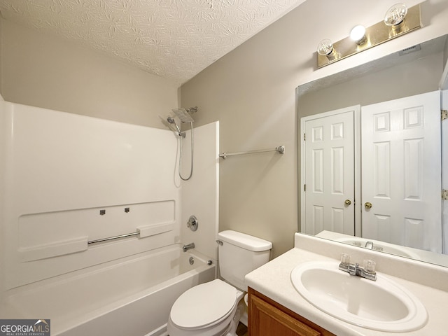 full bathroom with vanity, shower / tub combination, a textured ceiling, and toilet