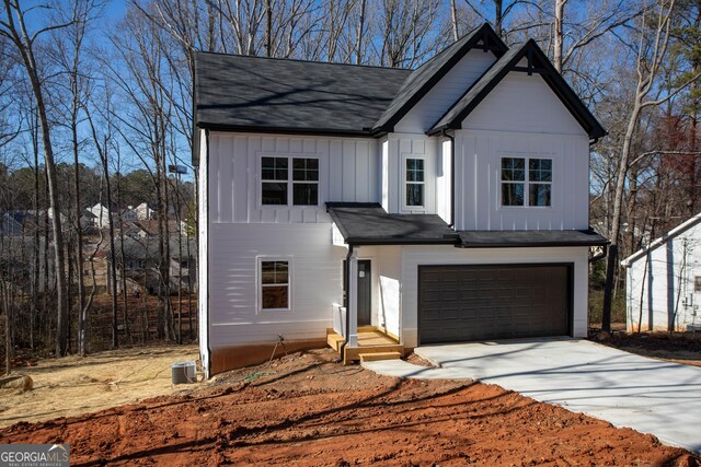 modern inspired farmhouse featuring a garage