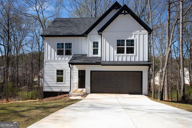 modern farmhouse style home with a garage