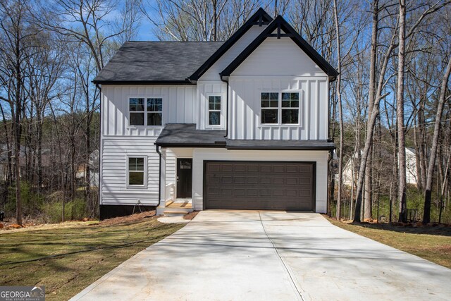 modern inspired farmhouse featuring a garage and central AC