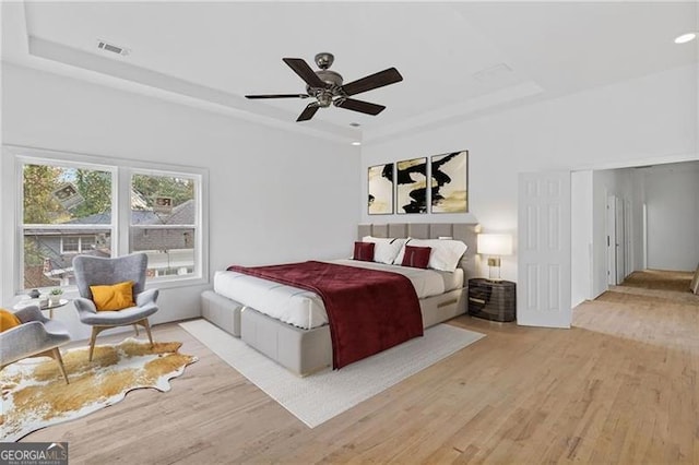 bedroom featuring ceiling fan and light hardwood / wood-style flooring