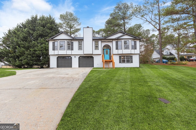 view of front of house with a front yard and a garage