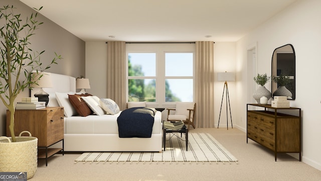 bedroom featuring light colored carpet