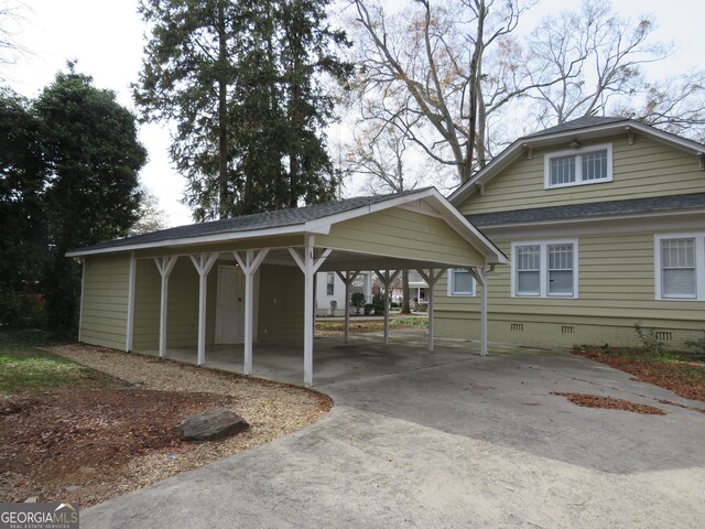 exterior space with a carport