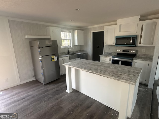 kitchen with white cabinets, sink, dark wood-type flooring, and appliances with stainless steel finishes