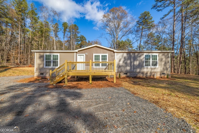 view of front of house featuring a wooden deck