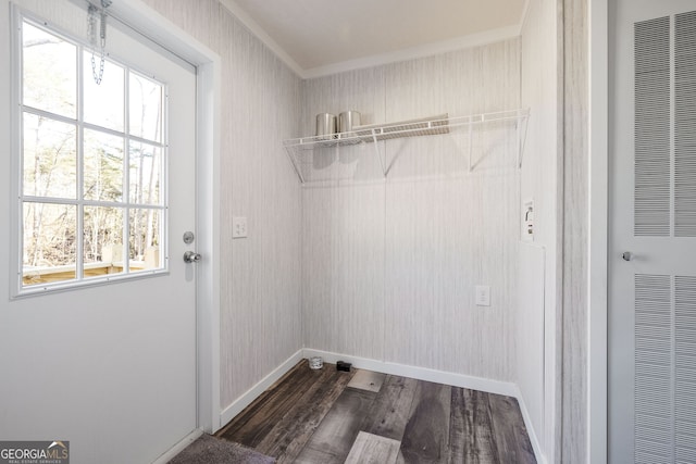 laundry room with plenty of natural light, dark hardwood / wood-style flooring, and ornamental molding