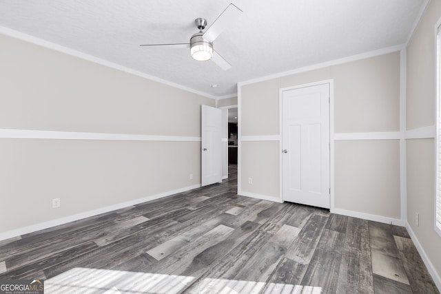 unfurnished bedroom featuring ceiling fan, dark hardwood / wood-style floors, and ornamental molding