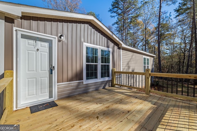 entrance to property featuring a wooden deck