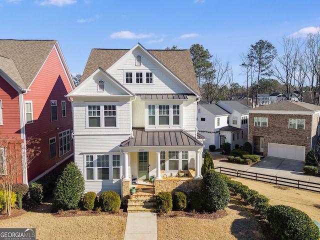 view of front of home featuring covered porch and a garage