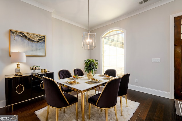 1560 Tapestry Rdg, Lawrenceville, GA 30045 - dining room featuring dark wood finished floors, crown molding, and a chandelier