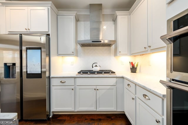 1560 Tapestry Rdg, Lawrenceville, GA 30045 - kitchen featuring stainless steel appliances, wall chimney exhaust hood, decorative backsplash, and white cabinetry