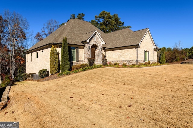 1560 Tapestry Rdg, Lawrenceville, GA 30045 - view of front facade featuring stone siding and roof with shingles