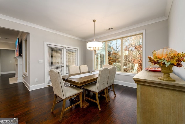 1560 Tapestry Rdg, Lawrenceville, GA 30045 - dining area featuring dark wood-style flooring and crown molding