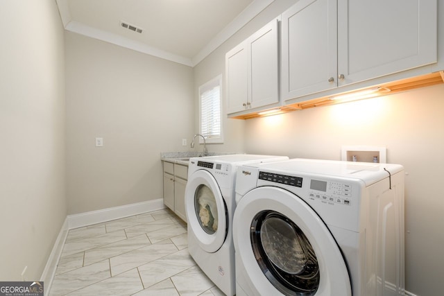 1560 Tapestry Rdg, Lawrenceville, GA 30045 - laundry room with light marble finish floors, cabinet space, washer and dryer, and ornamental molding