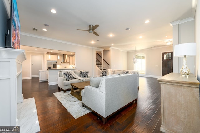 1560 Tapestry Rdg, Lawrenceville, GA 30045 - living area featuring ornamental molding, stairs, a ceiling fan, dark wood-type flooring, and recessed lighting