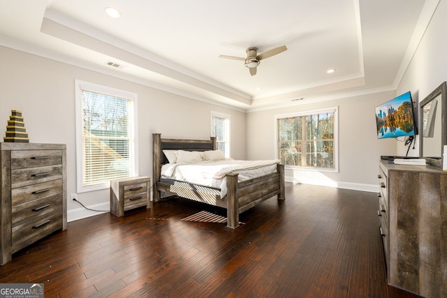 1560 Tapestry Rdg, Lawrenceville, GA 30045 - bedroom with a raised ceiling, dark wood-style flooring, recessed lighting, crown molding, and ceiling fan