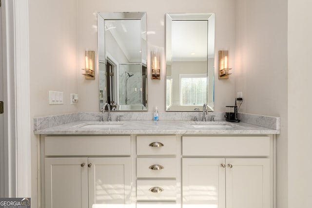 1560 Tapestry Rdg, Lawrenceville, GA 30045 - bathroom featuring double vanity, a shower with shower door, and ornamental molding