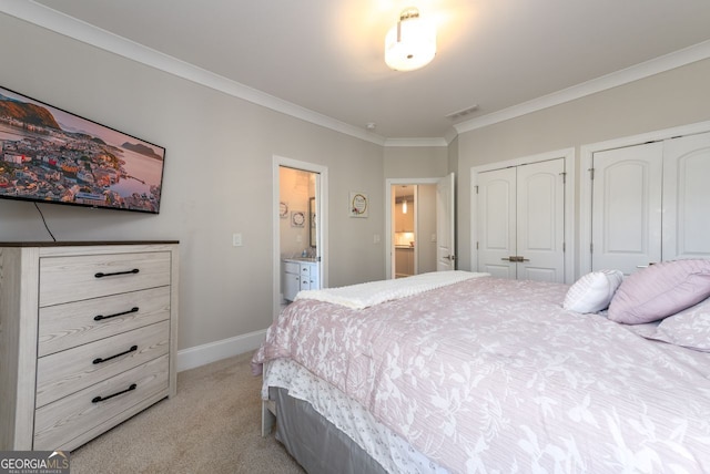 1560 Tapestry Rdg, Lawrenceville, GA 30045 - bedroom with light colored carpet, two closets, crown molding, and ensuite bathroom
