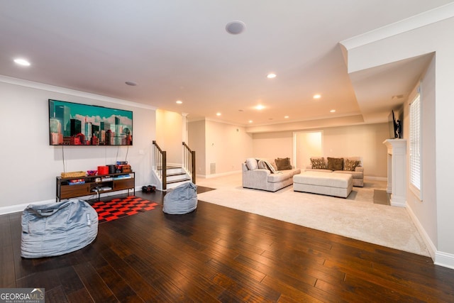1560 Tapestry Rdg, Lawrenceville, GA 30045 - living area featuring wood-type flooring, stairway, recessed lighting, and crown molding