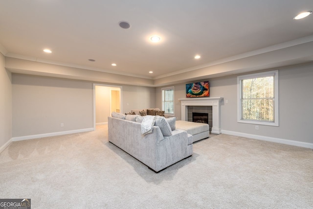 1560 Tapestry Rdg, Lawrenceville, GA 30045 - living area with light carpet, healthy amount of natural light, recessed lighting, ornamental molding, and a raised ceiling