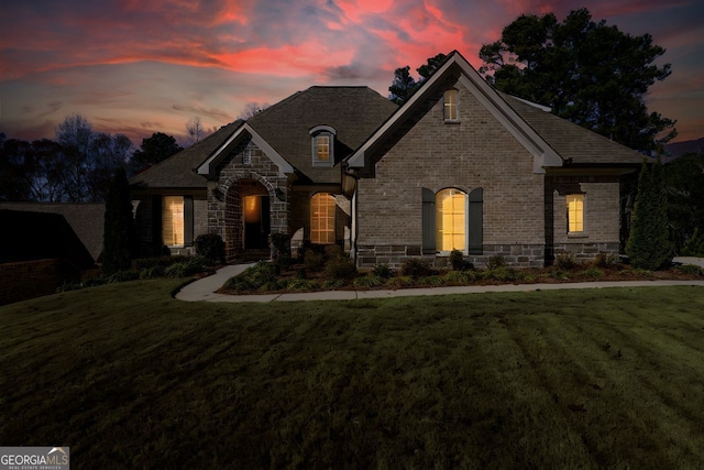 1560 Tapestry Rdg, Lawrenceville, GA 30045 - french provincial home featuring a front yard, stone siding, and brick siding