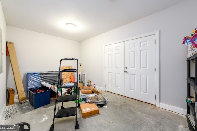 1560 Tapestry Rdg, Lawrenceville, GA 30045 - bedroom featuring concrete flooring and a closet