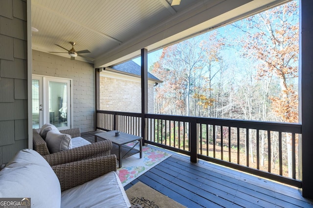 1560 Tapestry Rdg, Lawrenceville, GA 30045 - wooden terrace featuring a ceiling fan and an outdoor living space