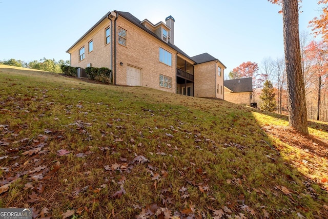 1560 Tapestry Rdg, Lawrenceville, GA 30045 - back of house with a lawn and a garage