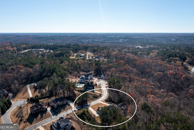 1560 Tapestry Rdg, Lawrenceville, GA 30045 - aerial view of property and surrounding area featuring a heavily wooded area