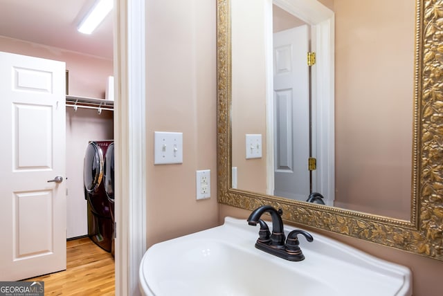 284 Tickanetley Rd, Ellijay, GA 30536 - bathroom with a sink, wood finished floors, and independent washer and dryer