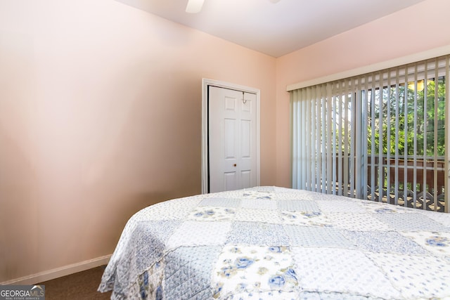 284 Tickanetley Rd, Ellijay, GA 30536 - carpeted bedroom featuring baseboards, a closet, and a ceiling fan