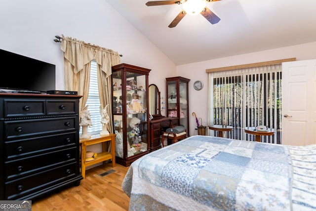 bedroom featuring vaulted ceiling, light wood-style floors, and ceiling fan