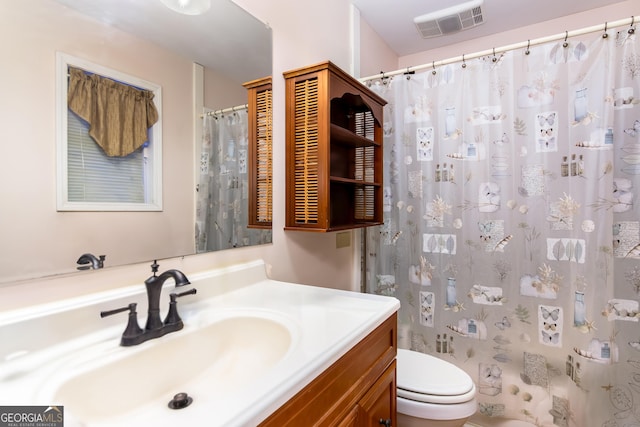 full bath with visible vents, toilet, vanity, and a shower with shower curtain