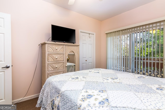 carpeted bedroom with a ceiling fan, baseboards, and a closet