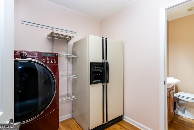 284 Tickanetley Rd, Ellijay, GA 30536 - clothes washing area with washer / dryer, wood finished floors, and baseboards