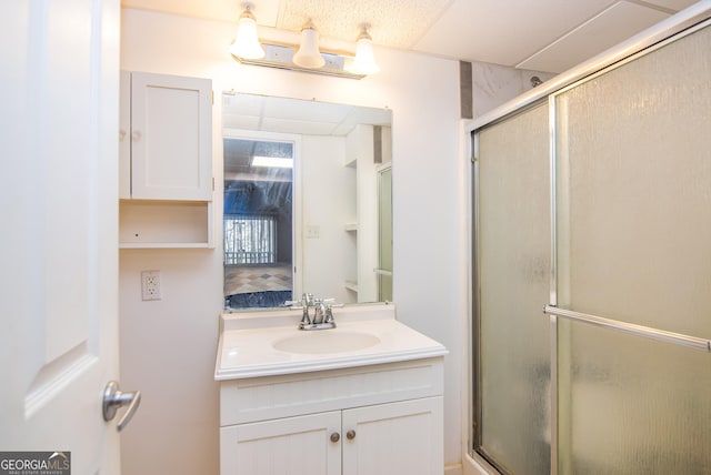 bathroom with an enclosed shower and vanity