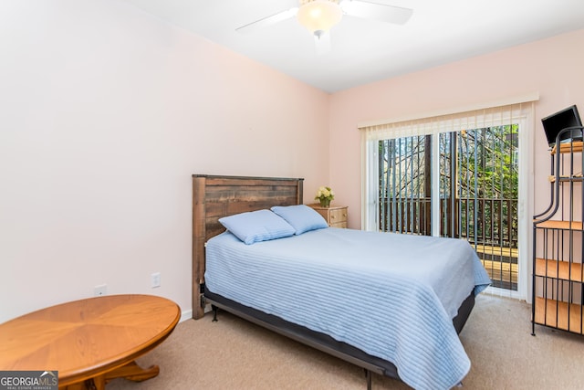 carpeted bedroom with ceiling fan and access to outside