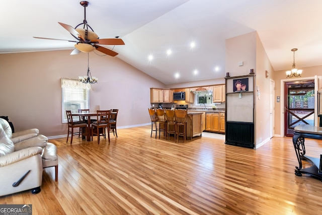 284 Tickanetley Rd, Ellijay, GA 30536 - living room with a chandelier, light wood-style floors, plenty of natural light, and high vaulted ceiling