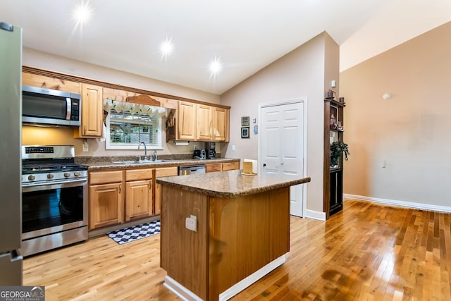 284 Tickanetley Rd, Ellijay, GA 30536 - kitchen featuring stainless steel appliances, a sink, vaulted ceiling, and light wood-style flooring