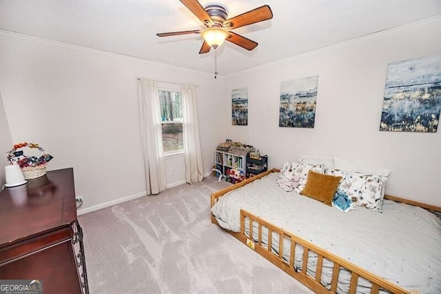 carpeted bedroom with crown molding and ceiling fan