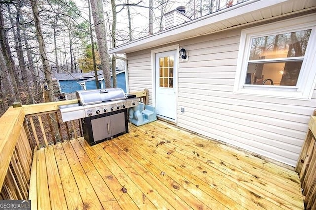 wooden terrace with grilling area