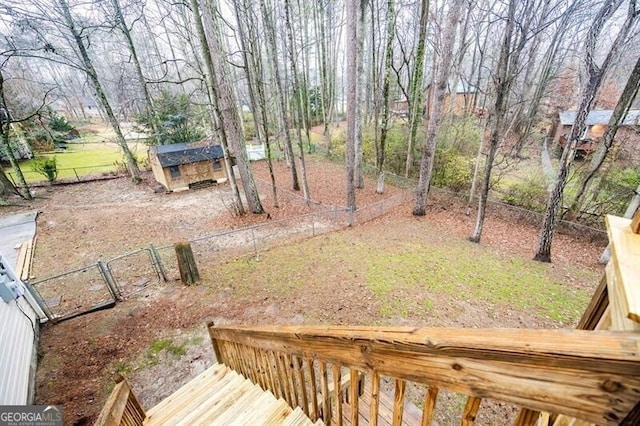 view of yard with a wooden deck and an outdoor structure