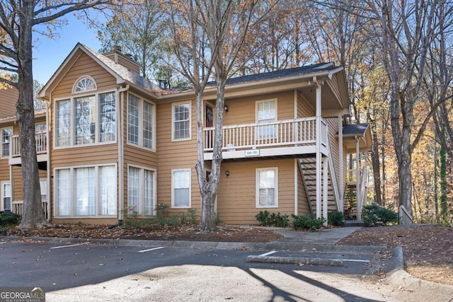 view of front of house with a garage and a balcony