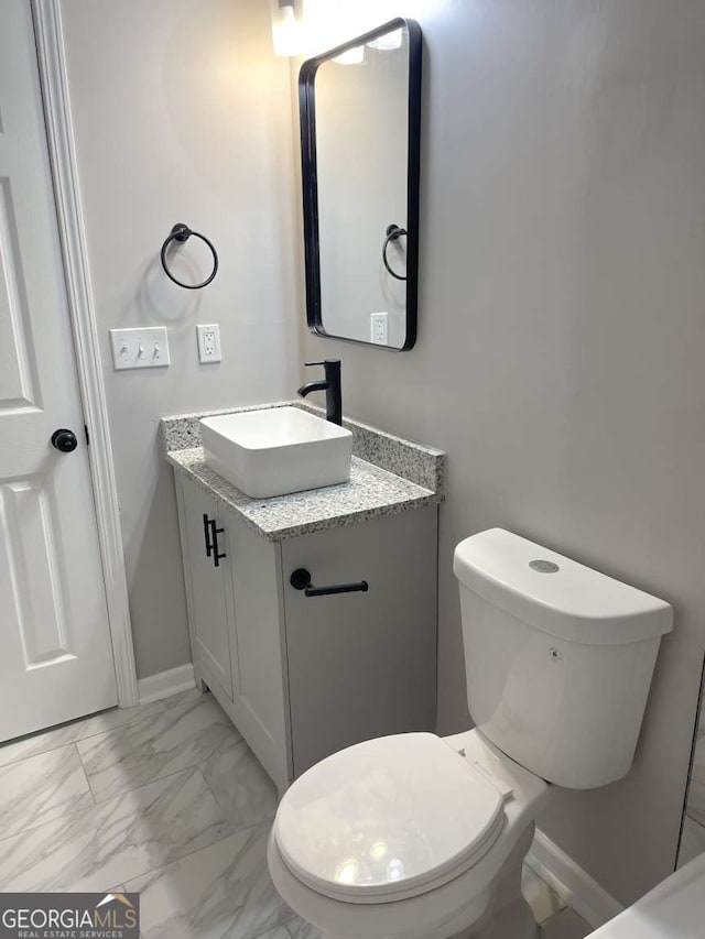 bathroom with vanity and toilet